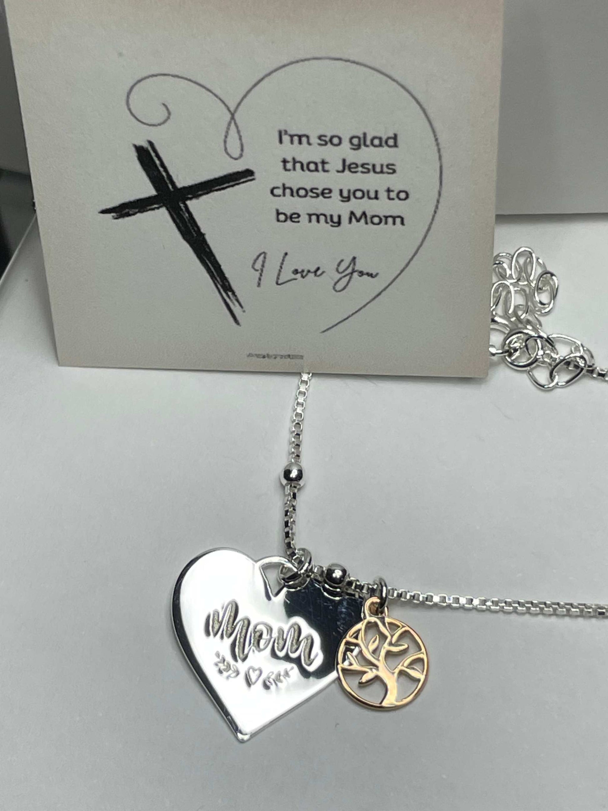 Sterling silver heart necklace with "Mom" engraving and rose gold family tree charm.