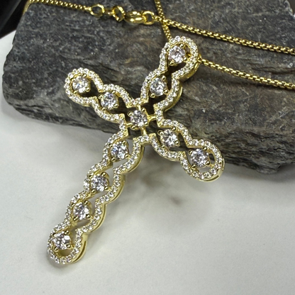 Gold cross pendant with diamonds on a chain
