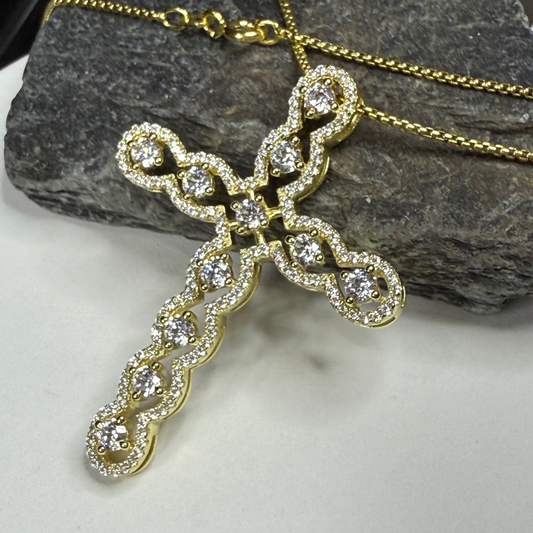 Gold cross pendant with diamonds on a chain