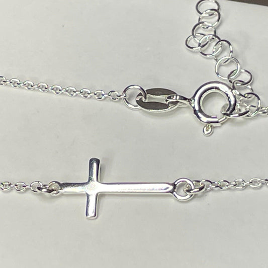 The newest member of the cross collection- the sideways cross anklet The cross is a beautiful daily reminder of just how far God will go to be with you. Sometimes we don't feel worthy, and that's because we really aren't. But in His eyes, we are worth it all.  He saw every single sin, and still chose the cross.  Thank Jesus.   11" + 1" extension sterling silver anklet with polished 8mm x 14mm sideways cross. The anklet has a spring ring closure. .925 Sterling Silver