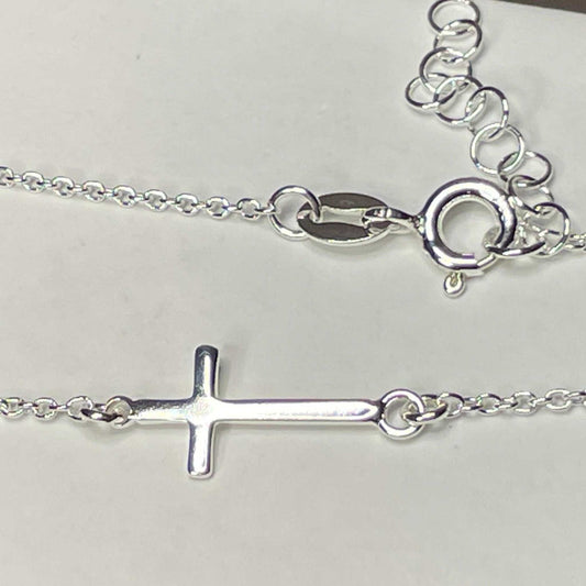 The newest member of the cross collection- the sideways cross anklet The cross is a beautiful daily reminder of just how far God will go to be with you. Sometimes we don't feel worthy, and that's because we really aren't. But in His eyes, we are worth it all.  He saw every single sin, and still chose the cross.  Thank Jesus.   11" + 1" extension sterling silver anklet with polished 8mm x 14mm sideways cross. The anklet has a spring ring closure. .925 Sterling Silver